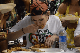 Molly Schuyler eats wings during Wing Bowl 22.