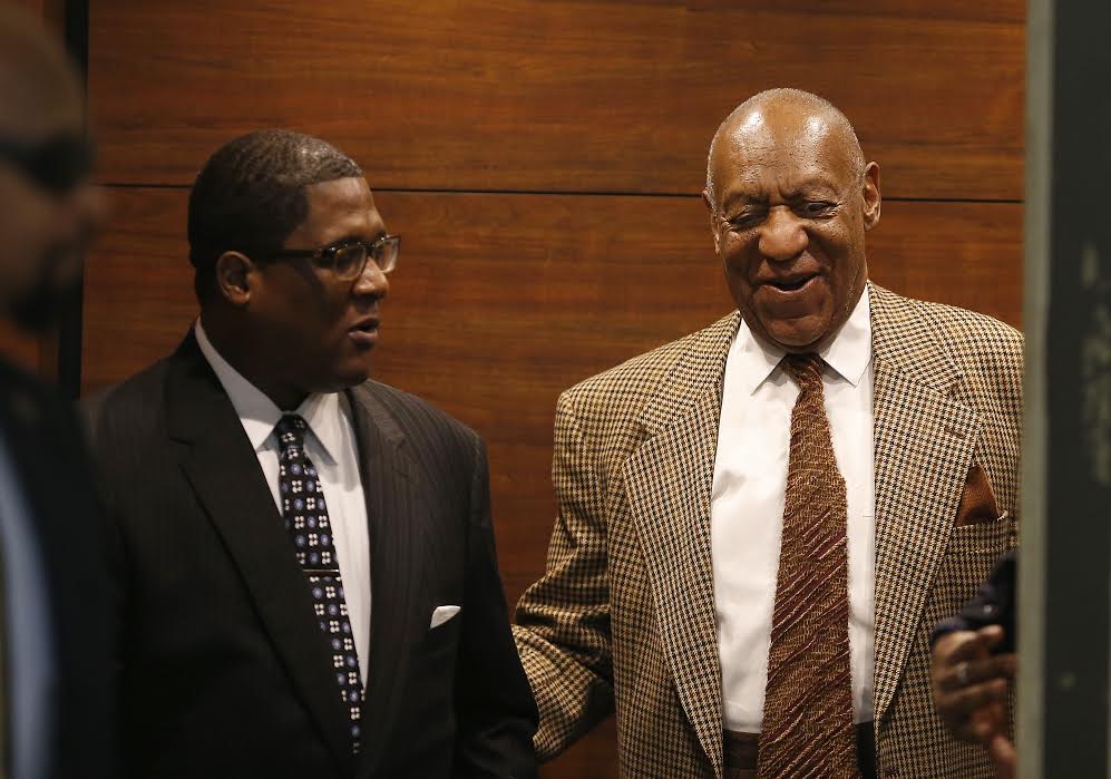 Bill Cosby, right, smiles as he exits the elevator as he returns to court Tuesday, December 13, 2016 in Norristown, PA for what is expected to be a two-day hearing in the accused comedian's latest attempt to get sexual assault charges against him dismissed.