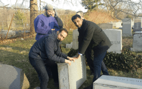 Several hours after a Jewish cemetery was desecrated in Philly, people arrived to help.
