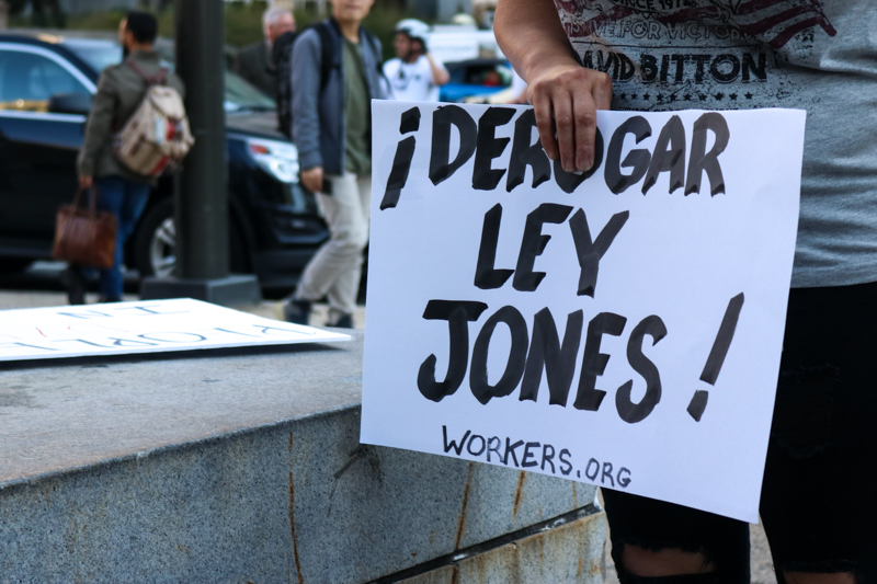 A sign calls in Spanish for the cancellation of the Jones Act.