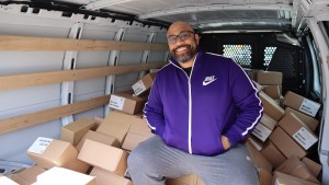 Deavin Reaves, executive director of the PA Harm Reduction Coalition, in front of a shipment of Narcan