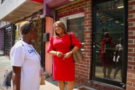 Quetcy Lozada talks with a constituent outside her campaign headquarters on North 5th Street
