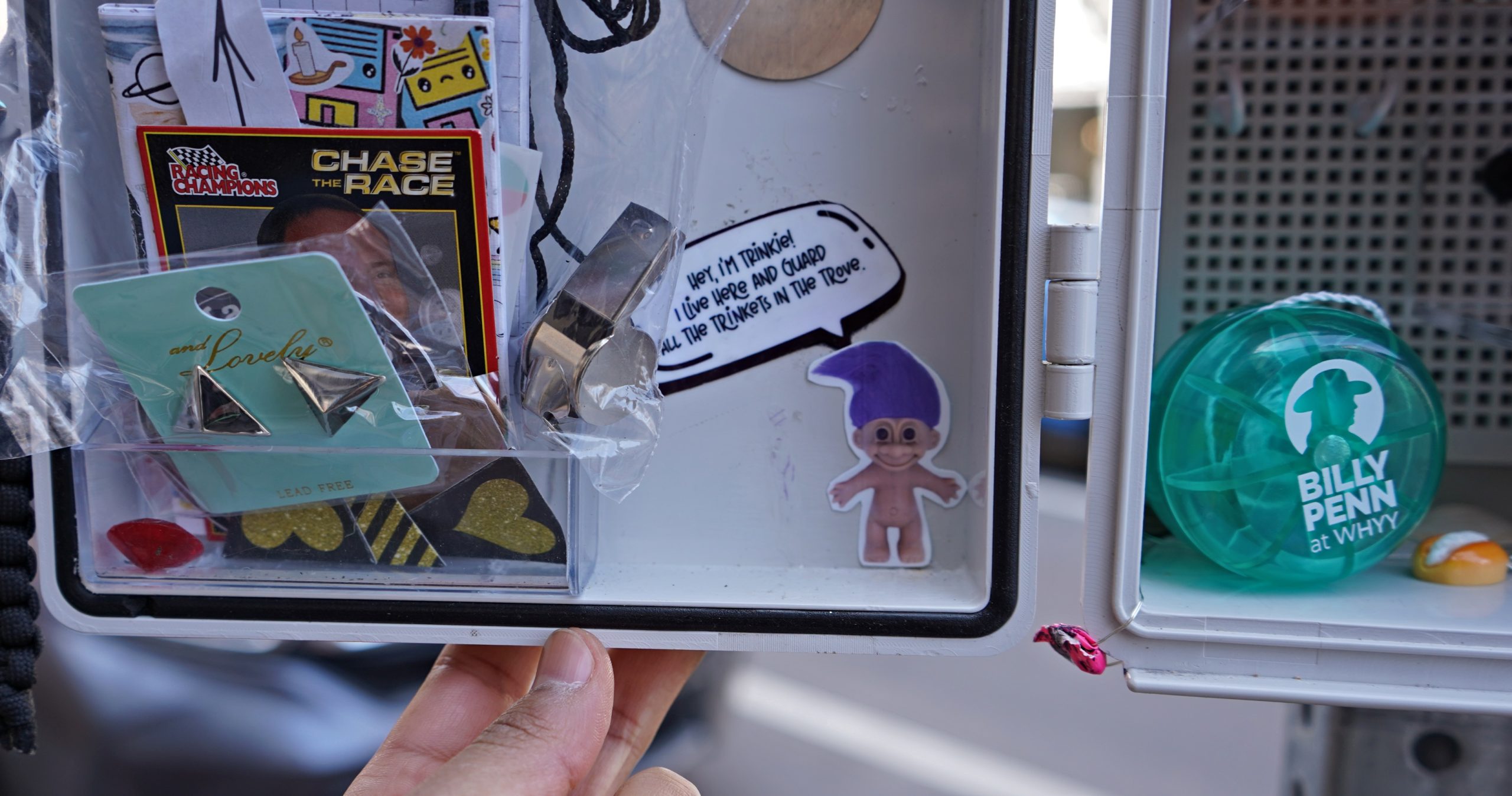 The small box on South Street offers passersby the chance to swap small toys, stickers, knick-knacks and whatever items of whimsy can fit on its shelves and in its pouches.