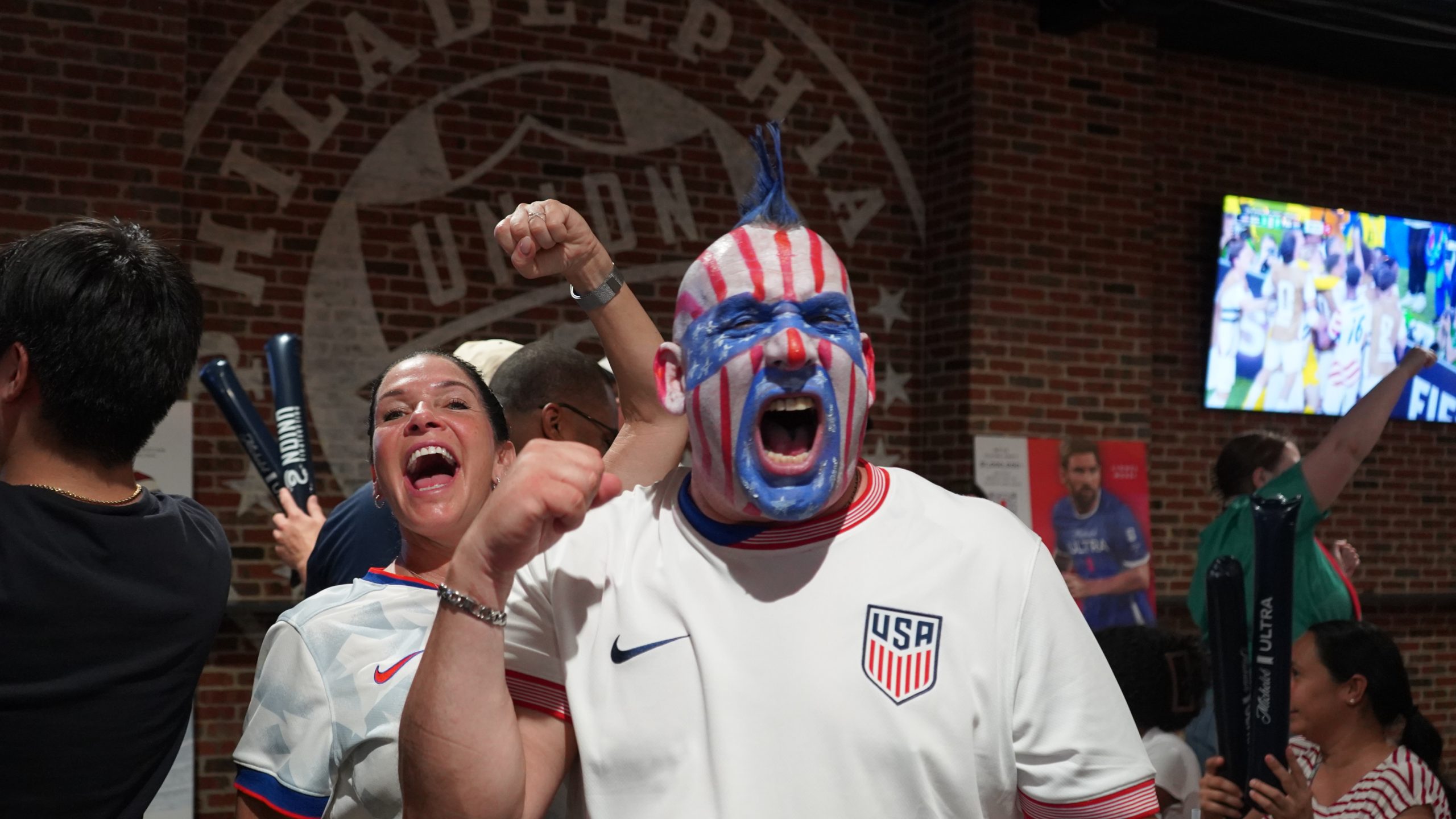 World Cup fans cheer on the U.S. team in Chester, after the Ivory Coast holds public training session ahead of Ecuador match